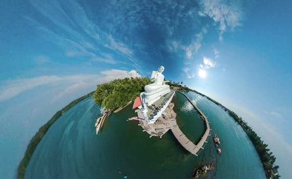 pexels-photo-2217658-2217658 A stunning 360-degree aerial view of a Buddha statue by a tranquil lake in Sri Lanka.